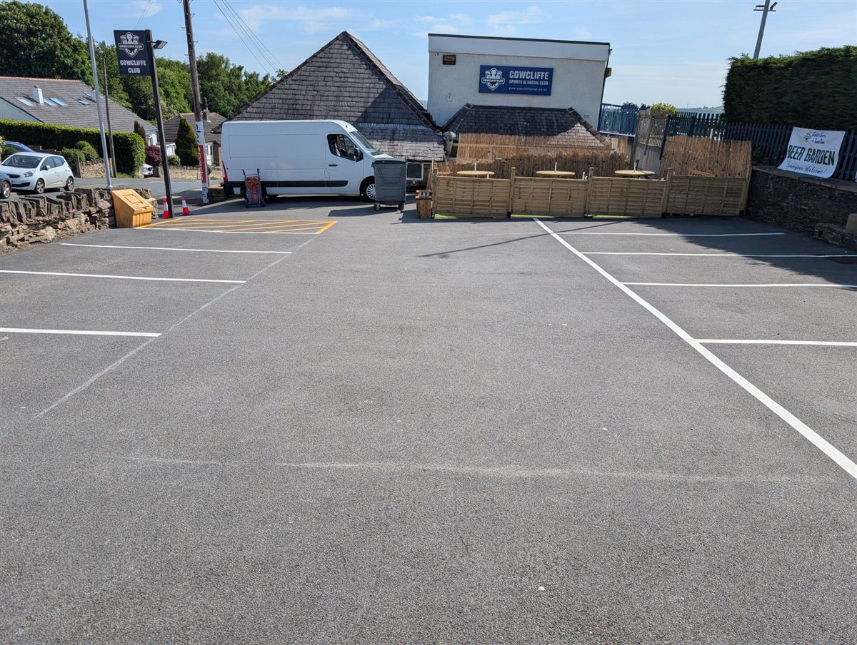 Newly marked car park bays and yellow hatching at Cowcliffe Sports and Social Club, Huddersfield